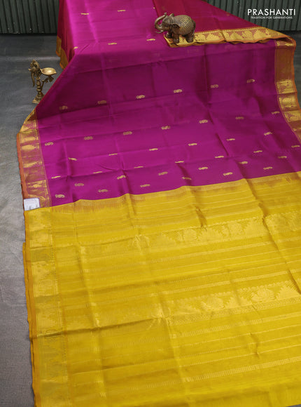 Silk cotton saree purple and mustard yellow with paisley zari woven buttas and temple & annam zari woven border
