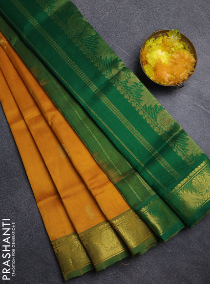 Silk cotton saree mustard yellow and green with paisley zari woven buttas and temple & annam zari woven border