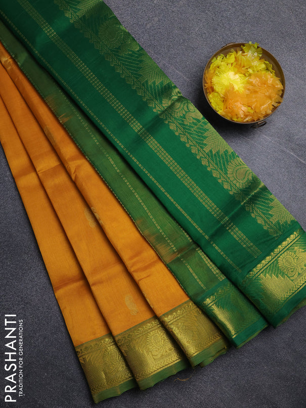 Silk cotton saree mustard yellow and green with paisley zari woven buttas and temple & annam zari woven border