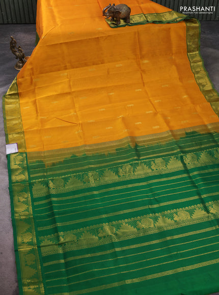 Silk cotton saree mustard yellow and green with paisley zari woven buttas and temple & annam zari woven border