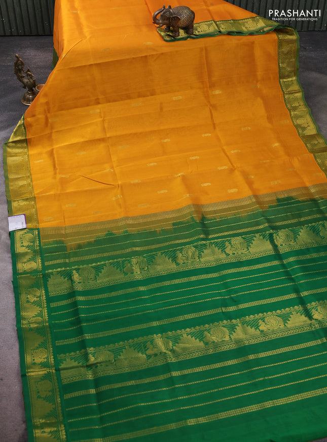 Silk cotton saree mustard yellow and green with paisley zari woven buttas and temple & annam zari woven border