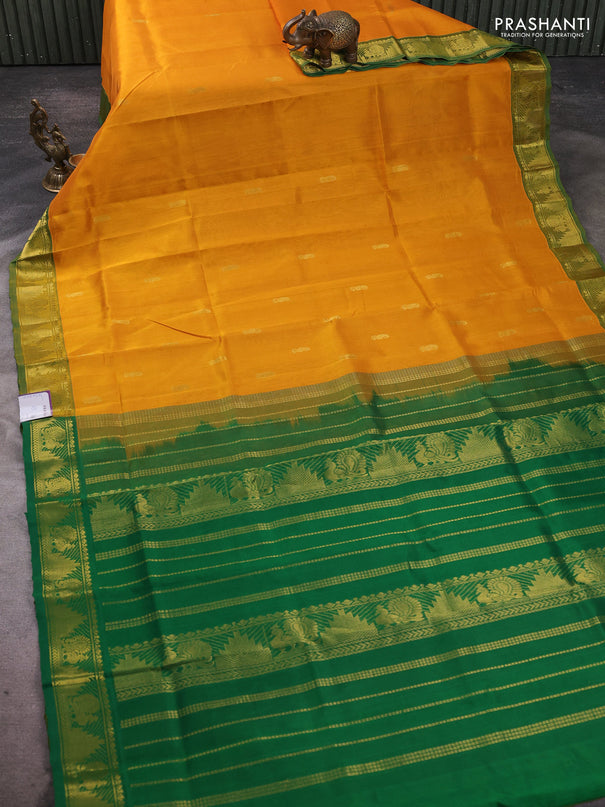 Silk cotton saree mustard yellow and green with paisley zari woven buttas and temple & annam zari woven border