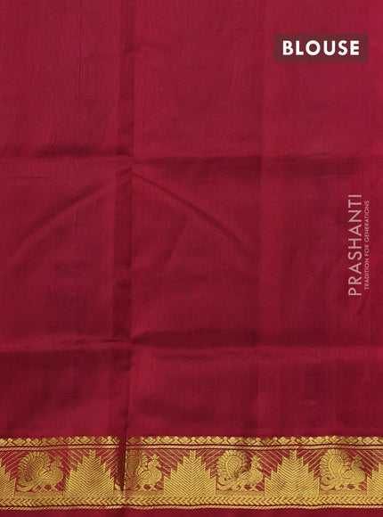 Silk cotton saree dual shade of greenish purple and wine shade with paisley zari woven buttas and temple & annam zari woven border