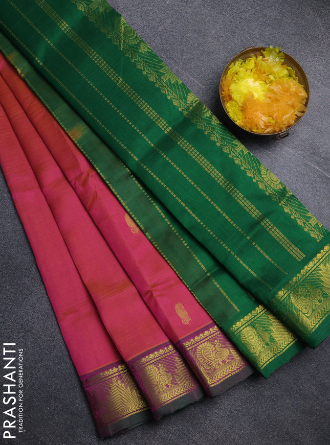 Silk cotton saree dual shade of pinkish orange and green with paisley zari woven buttas and temple & annam zari woven border