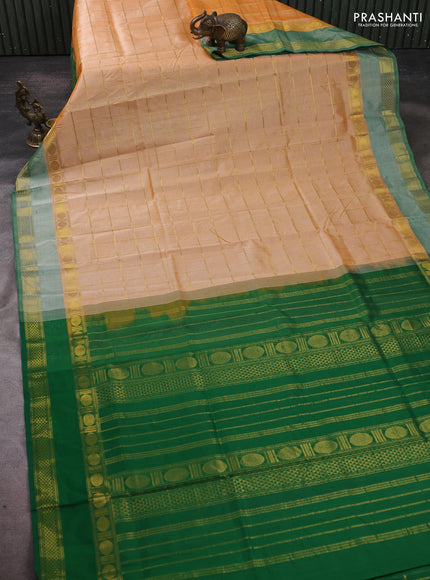 Silk cotton saree pale orange and green with allover zari checked pattern and rettapet zari woven border