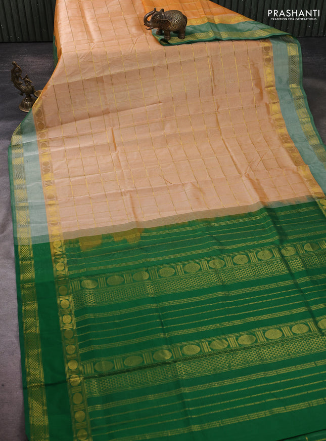 Silk cotton saree pale orange and green with allover zari checked pattern and rettapet zari woven border