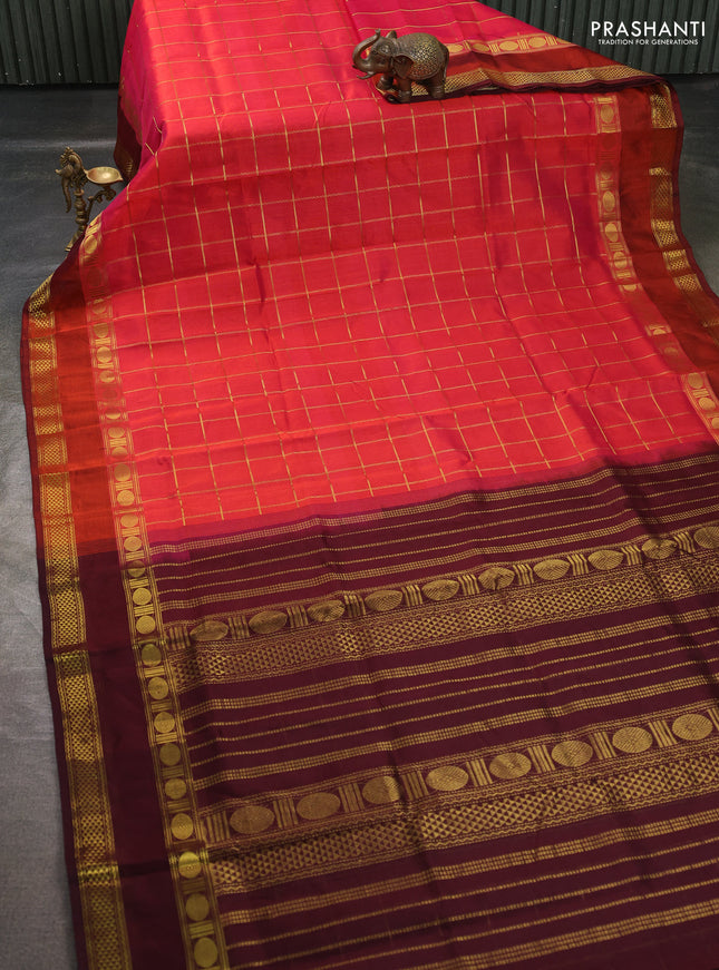 Silk cotton saree pinkish orange and wine shade with allover zari checked pattern and rettapet zari woven border