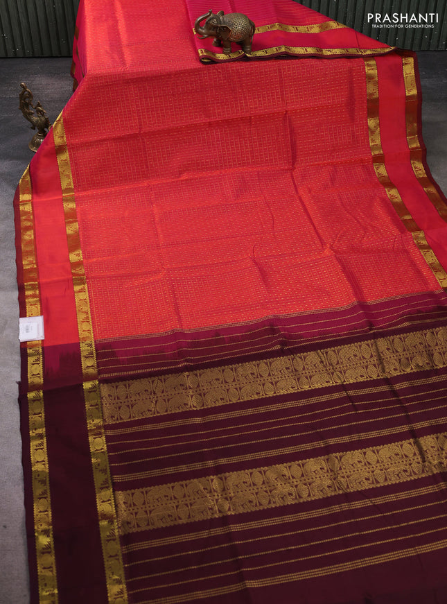 Silk cotton saree dual shade of pinkish orange and deep purple with allover lakshadeepam pattern and rettapet zari woven border