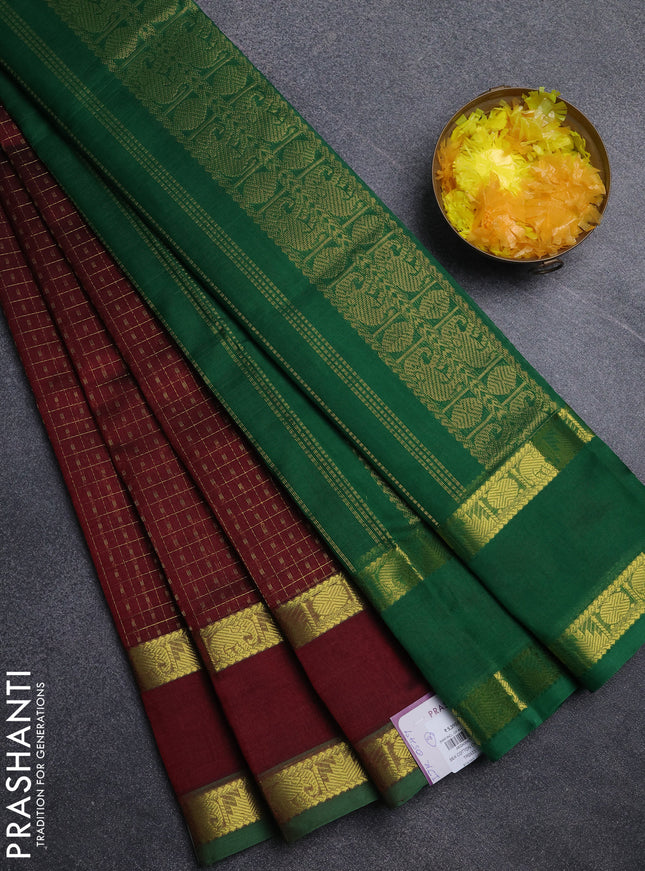 Silk cotton saree deep maroon and green with allover lakshadeepam pattern and rettapet zari woven border
