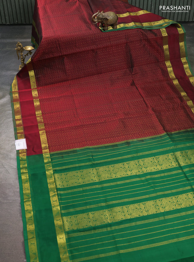 Silk cotton saree deep maroon and green with allover lakshadeepam pattern and rettapet zari woven border