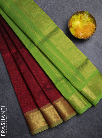 Silk cotton saree maroon and light green with allover self emboss jacquard pattern and elephant design zari woven border