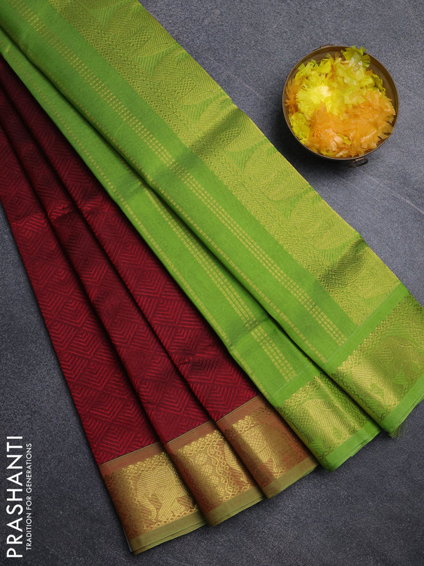 Silk cotton saree maroon and light green with allover self emboss jacquard pattern and elephant design zari woven border