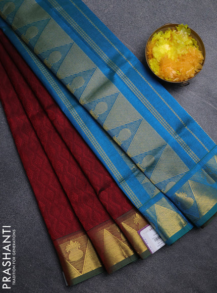 Silk cotton saree maroon and cs blue with allover self emboss jacquard pattern and temple design zari woven border