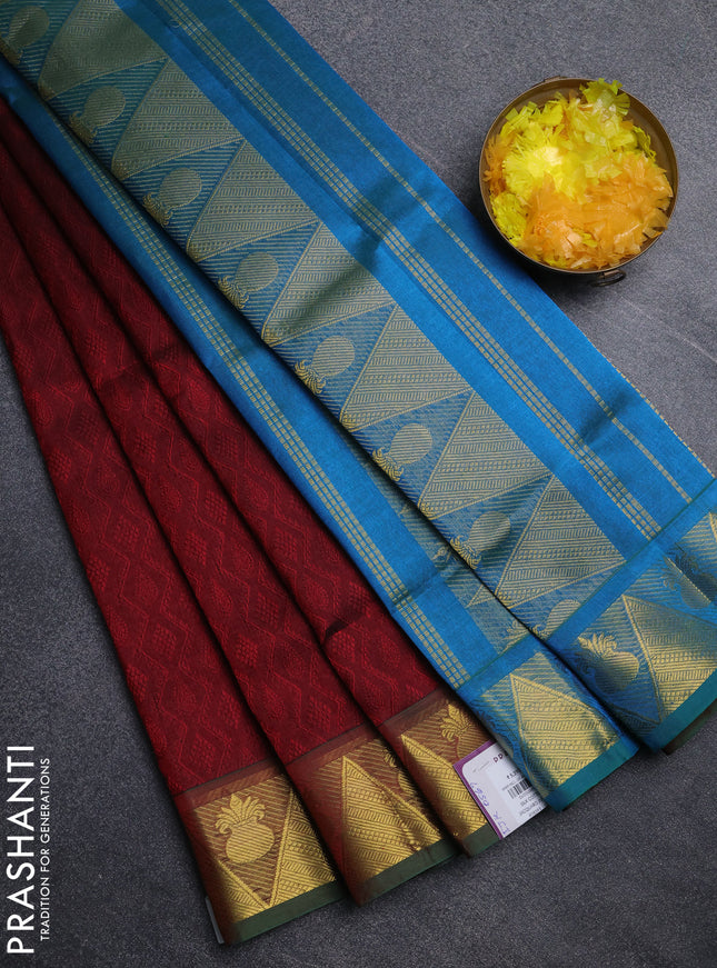 Silk cotton saree maroon and cs blue with allover self emboss jacquard pattern and temple design zari woven border