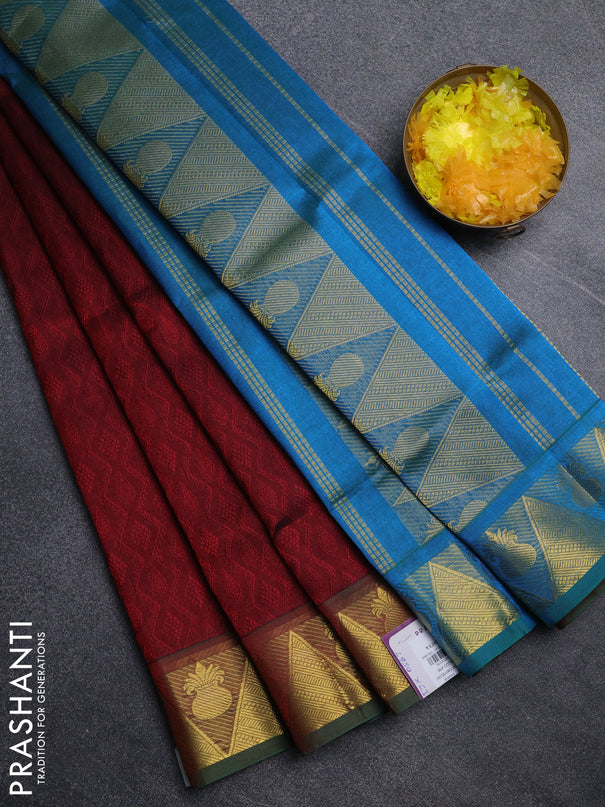 Silk cotton saree maroon and cs blue with allover self emboss jacquard pattern and temple design zari woven border