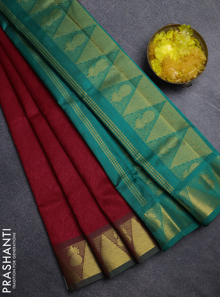 Silk cotton saree red and teal green with allover self emboss jacquard pattern and temple design zari woven border