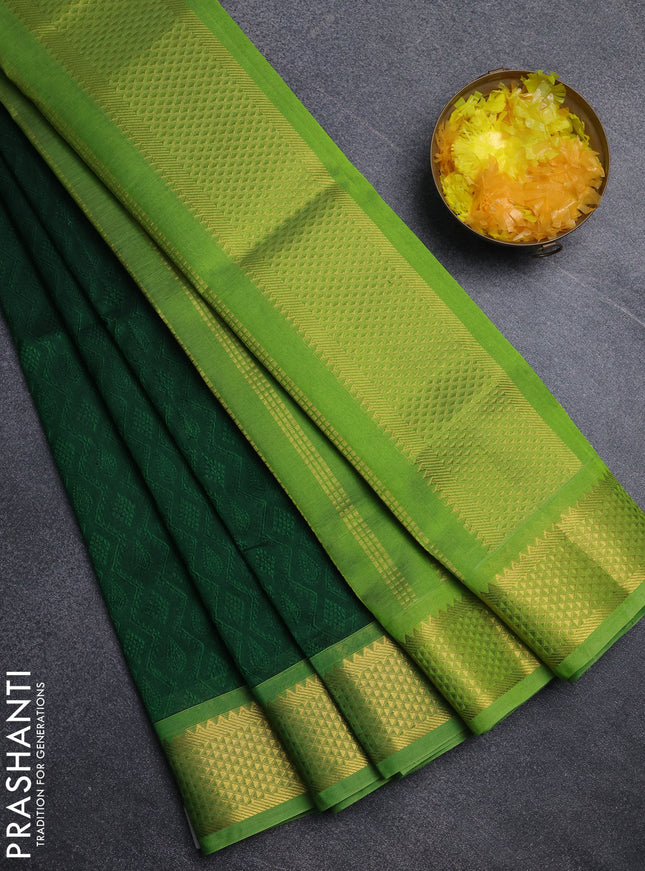 Silk cotton saree bottle green and light green with allover self emboss jacquard pattern and temple design zari woven border
