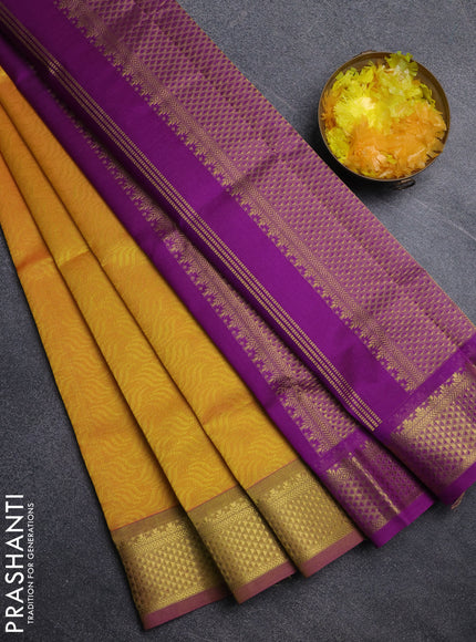 Silk cotton saree mango yellow and purple with allover self emboss jacquard pattern and temple design zari woven border