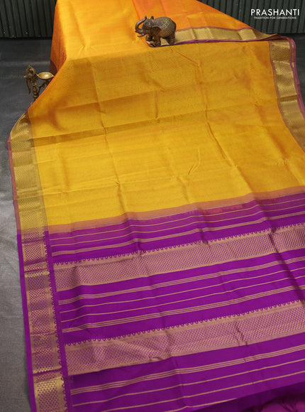 Silk cotton saree mango yellow and purple with allover self emboss jacquard pattern and temple design zari woven border