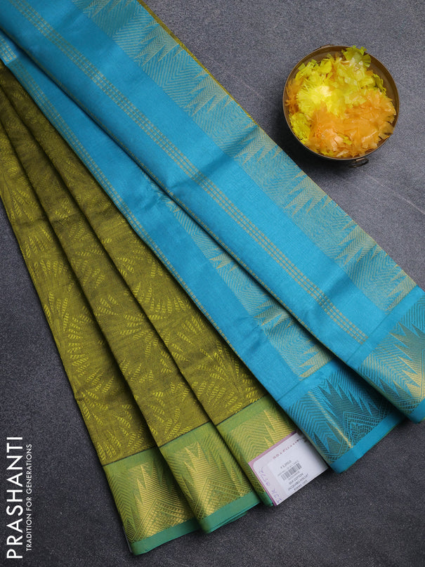 Silk cotton saree light green and cs blue with allover self emboss jacquard pattern and temple design zari woven border
