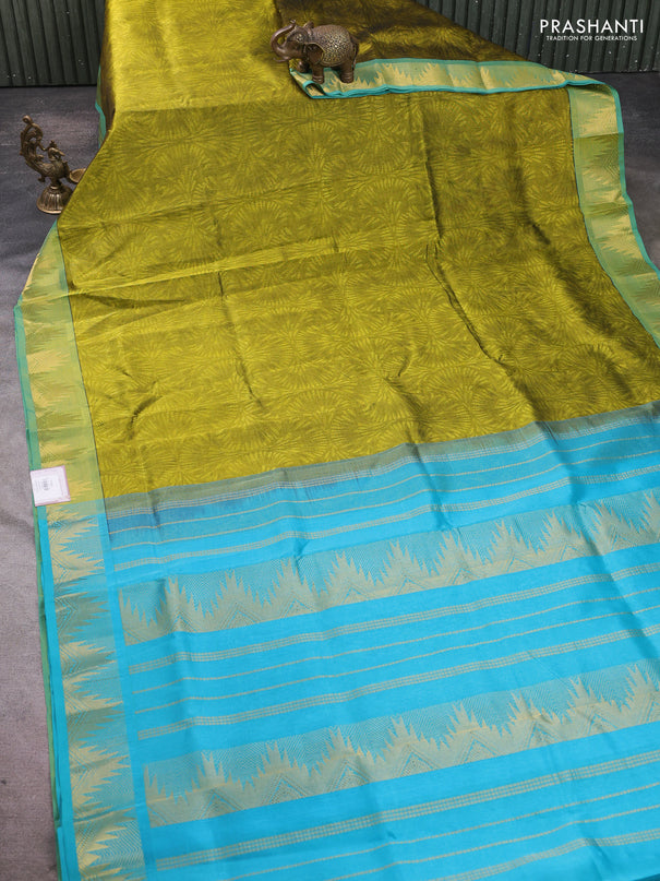 Silk cotton saree light green and cs blue with allover self emboss jacquard pattern and temple design zari woven border