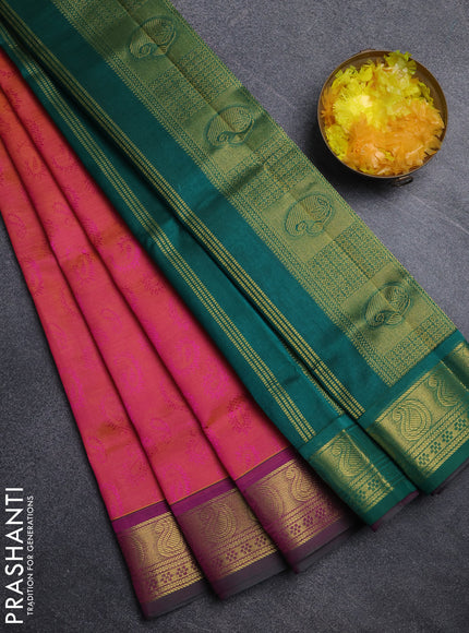 Silk cotton saree dual shade of pinkish orange and green with allover self emboss jacquard pattern and paisley zari woven border