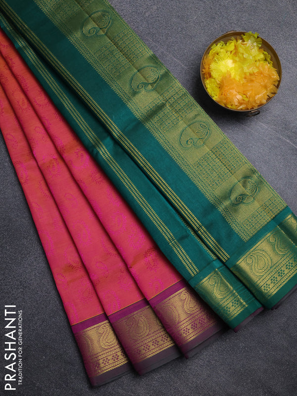 Silk cotton saree dual shade of pinkish orange and green with allover self emboss jacquard pattern and paisley zari woven border