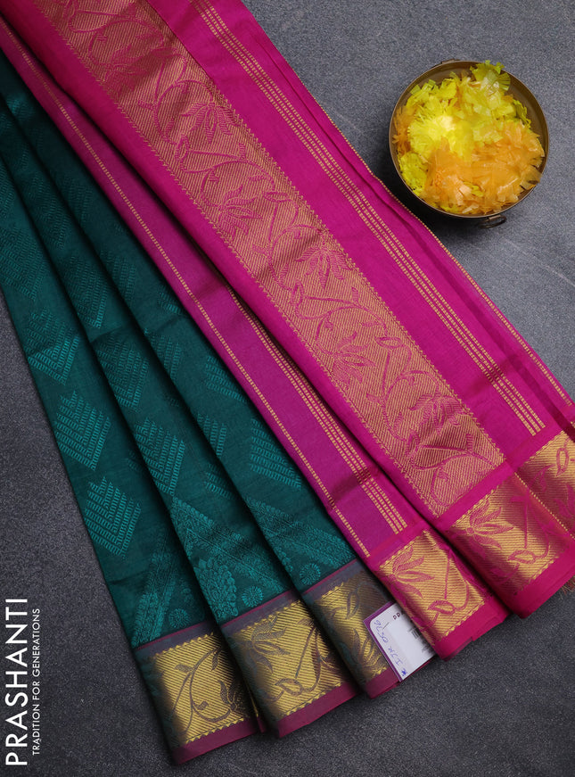 Silk cotton saree peacock green and pink with allover self emboss jacquard pattern and zari woven border