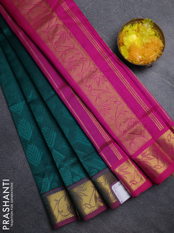 Silk cotton saree peacock green and pink with allover self emboss jacquard pattern and zari woven border