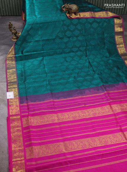 Silk cotton saree peacock green and pink with allover self emboss jacquard pattern and zari woven border
