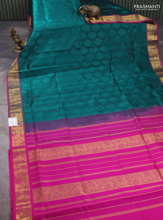 Silk cotton saree peacock green and pink with allover self emboss jacquard pattern and zari woven border