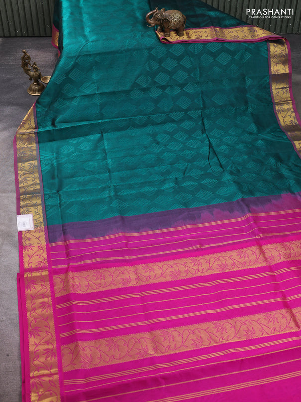 Silk cotton saree peacock green and pink with allover self emboss jacquard pattern and zari woven border