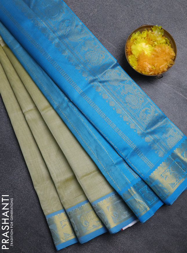 Silk cotton saree pista green and cs blue with allover vairosi pattern and annam zari woven border