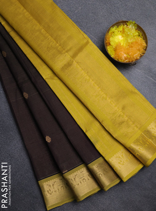 Silk cotton saree coffee brown and mustard yellow with allover vairosi pattern & buttas and elephant zari woven border