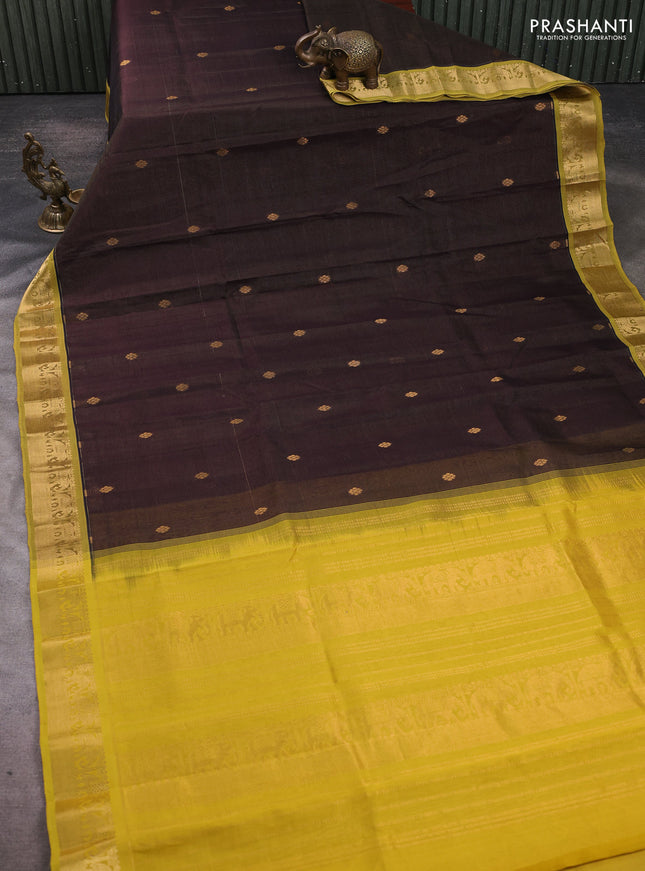 Silk cotton saree coffee brown and mustard yellow with allover vairosi pattern & buttas and elephant zari woven border