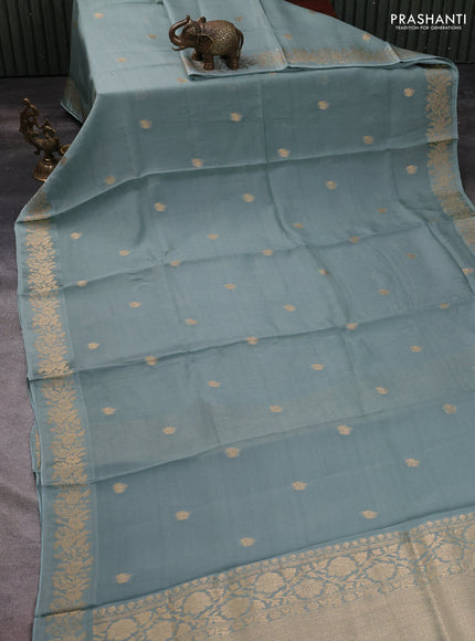 Silk kota saree pastel green shade with zari woven buttas and floral zari woven border