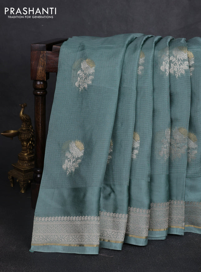 Silk kota saree pastel blue shade with floral zari woven buttas and zari woven border