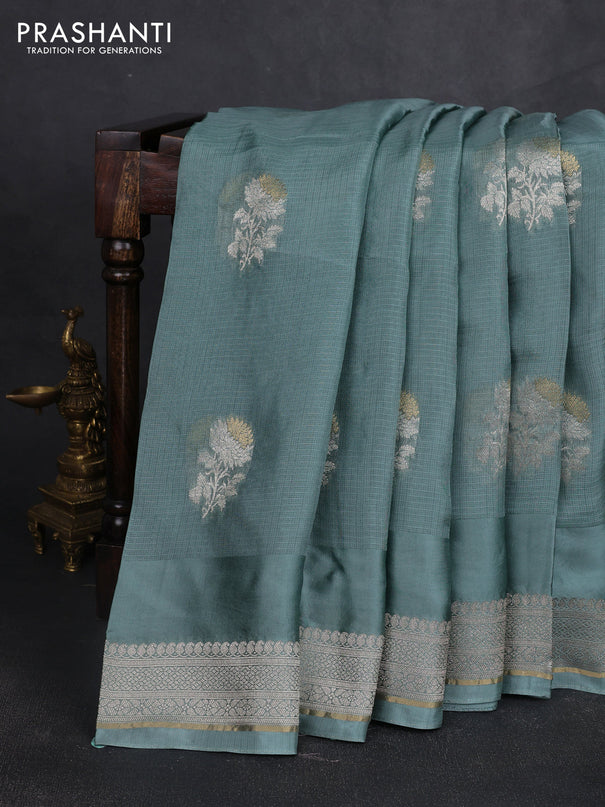 Silk kota saree pastel blue shade with floral zari woven buttas and zari woven border