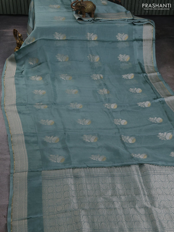 Silk kota saree pastel blue shade with floral zari woven buttas and zari woven border