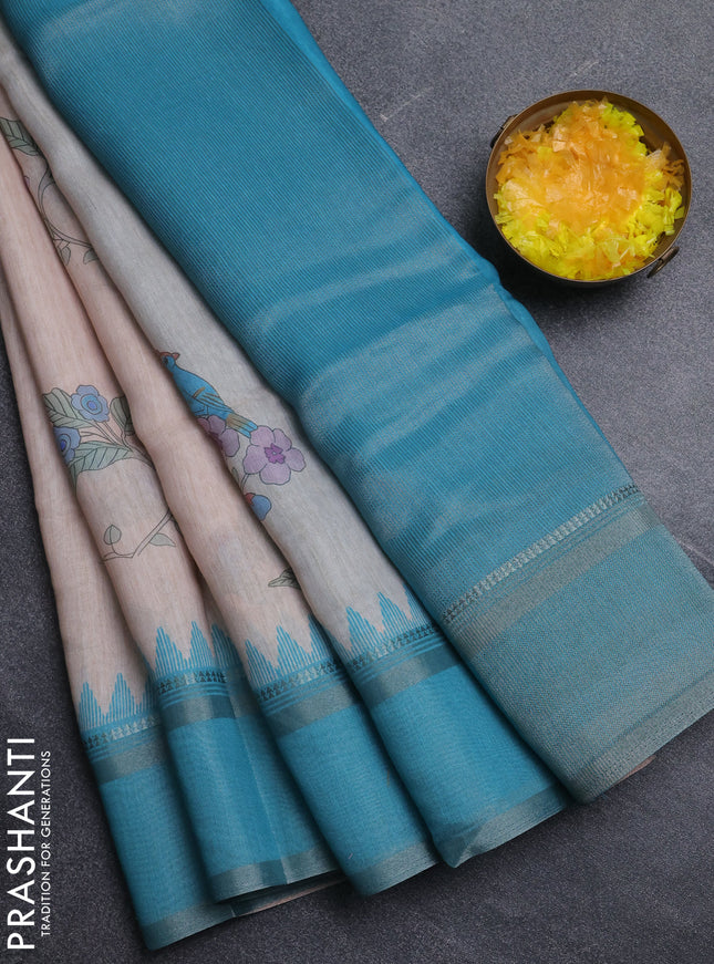 Art Linen saree teal blue with allover floal prints and temple design rettapet zari woven border