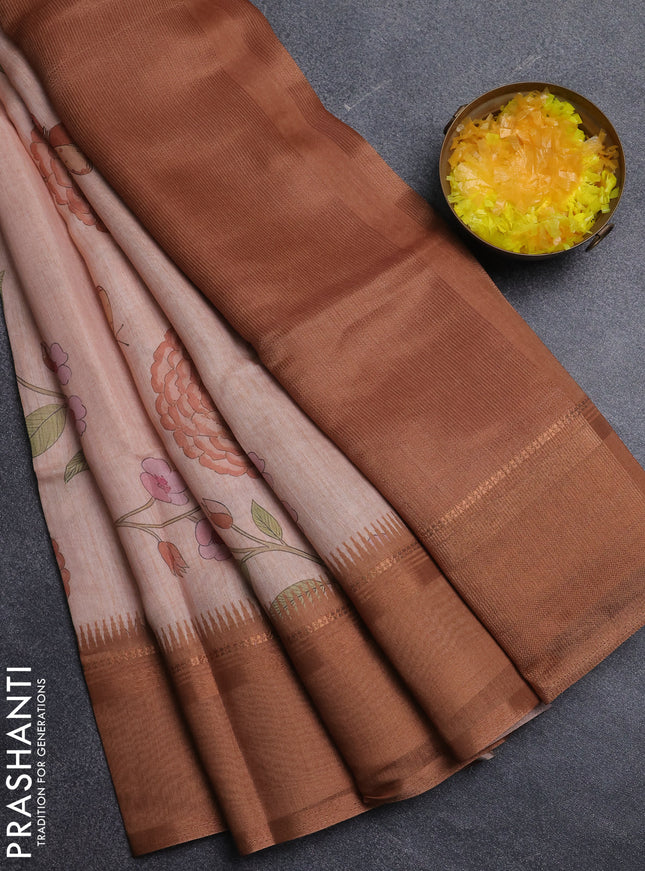 Art Linen saree pale orange and rust shade with allover floal prints and temple design rettapet zari woven border