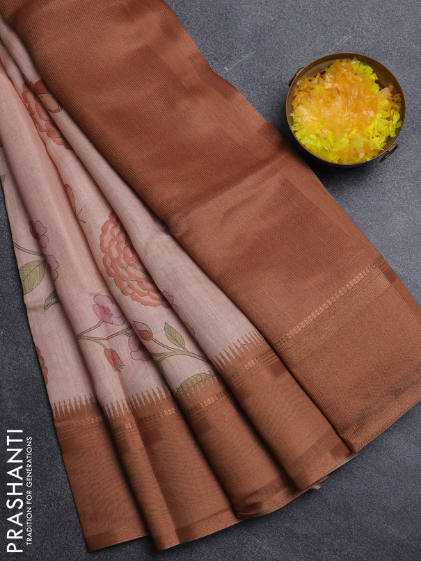 Art Linen saree pale orange and rust shade with allover floal prints and temple design rettapet zari woven border