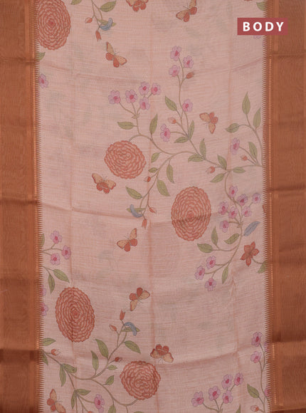 Art Linen saree pale orange and rust shade with allover floal prints and temple design rettapet zari woven border