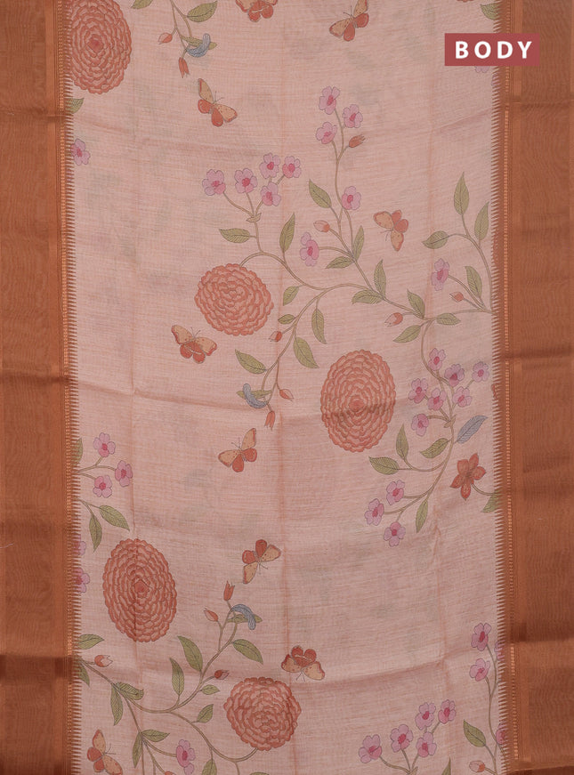 Art Linen saree pale orange and rust shade with allover floal prints and temple design rettapet zari woven border