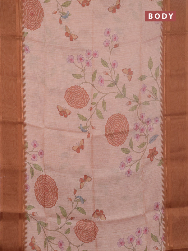 Art Linen saree pale orange and rust shade with allover floal prints and temple design rettapet zari woven border