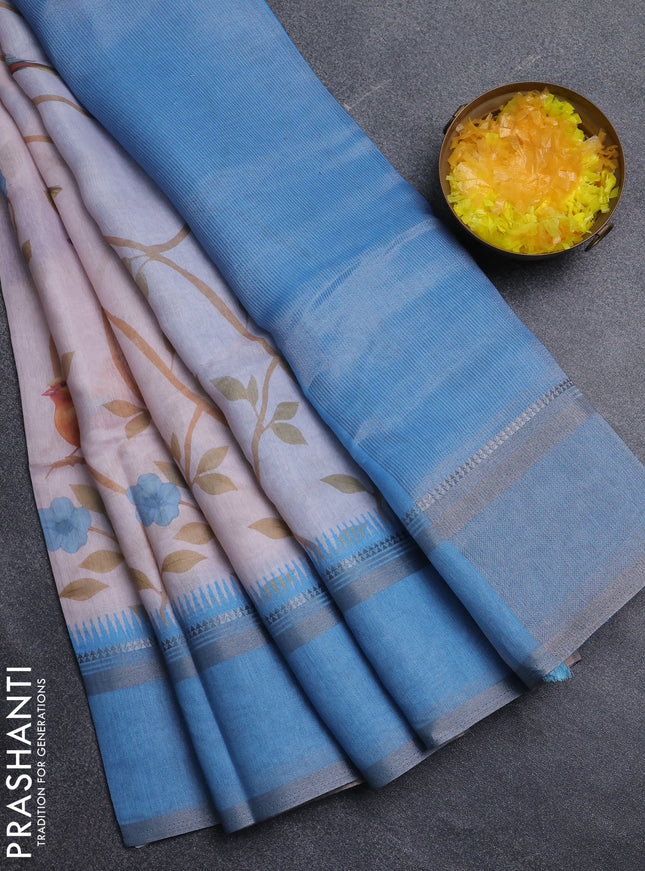 Art Linen saree pastel blue and blue shade with allover floral prints and temple design rettapet zari woven border