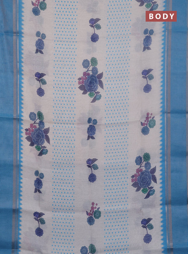 Art Linen saree pastel blue and blue with allover floral prints and temple design rettapet zari woven border