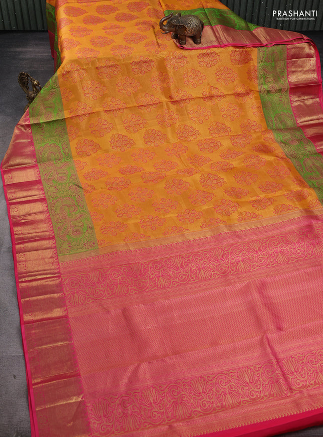 Pure kanchipuram silk saree mustard yellow and pink with allover floral self emboss pattern and long annam zari woven border