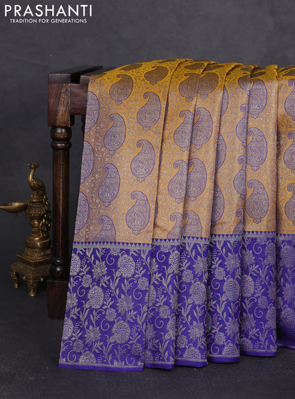 Pure kanchipuram silk saree dual shade of yellow and blue with allover zari woven paisley self emboss pattern and long paisley zari woven border