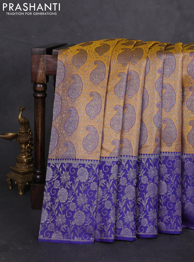 Pure kanchipuram silk saree dual shade of yellow and blue with allover zari woven paisley self emboss pattern and long paisley zari woven border
